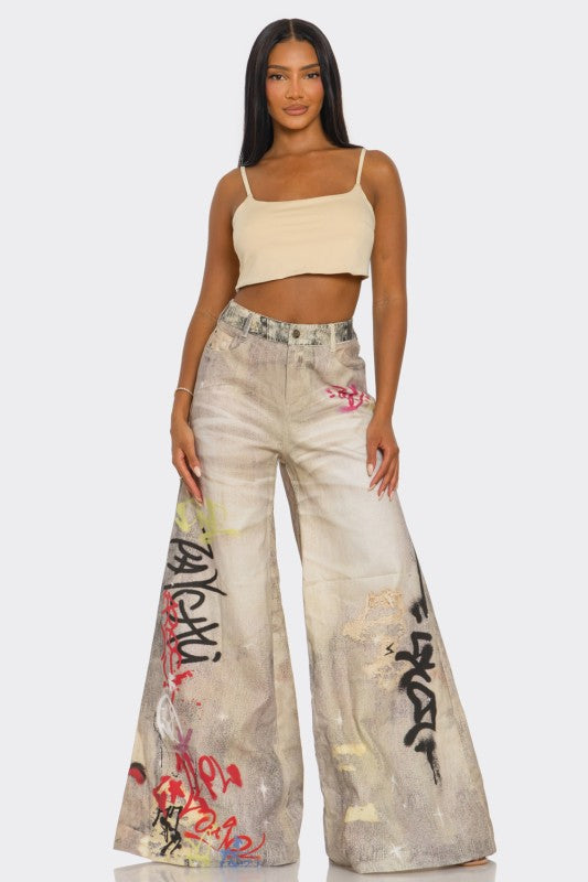 Street Poet Graffiti Wide-Leg Jeans See size chart under “more details” The Fashion Celestial