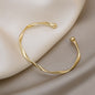 A Sleek And Stylish Twisted Texture Golden Bangle NovaCart