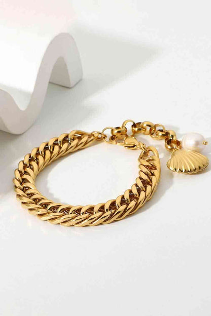 GlamGold 18K Gold-Plated Curb Chain Bracelet – Elegant Pearl Accent See size chart under “more details” The Fashion Celestial