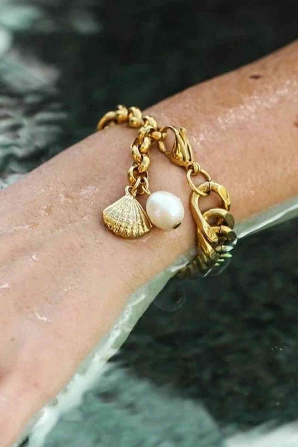 GlamGold 18K Gold-Plated Curb Chain Bracelet – Elegant Pearl Accent See size chart under “more details” The Fashion Celestial