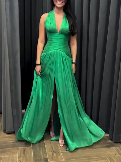 Emerald Green Plunging Neckline Gown With Pleated Skirt And Side Slit See size chart under “more details” The Fashion Celestial