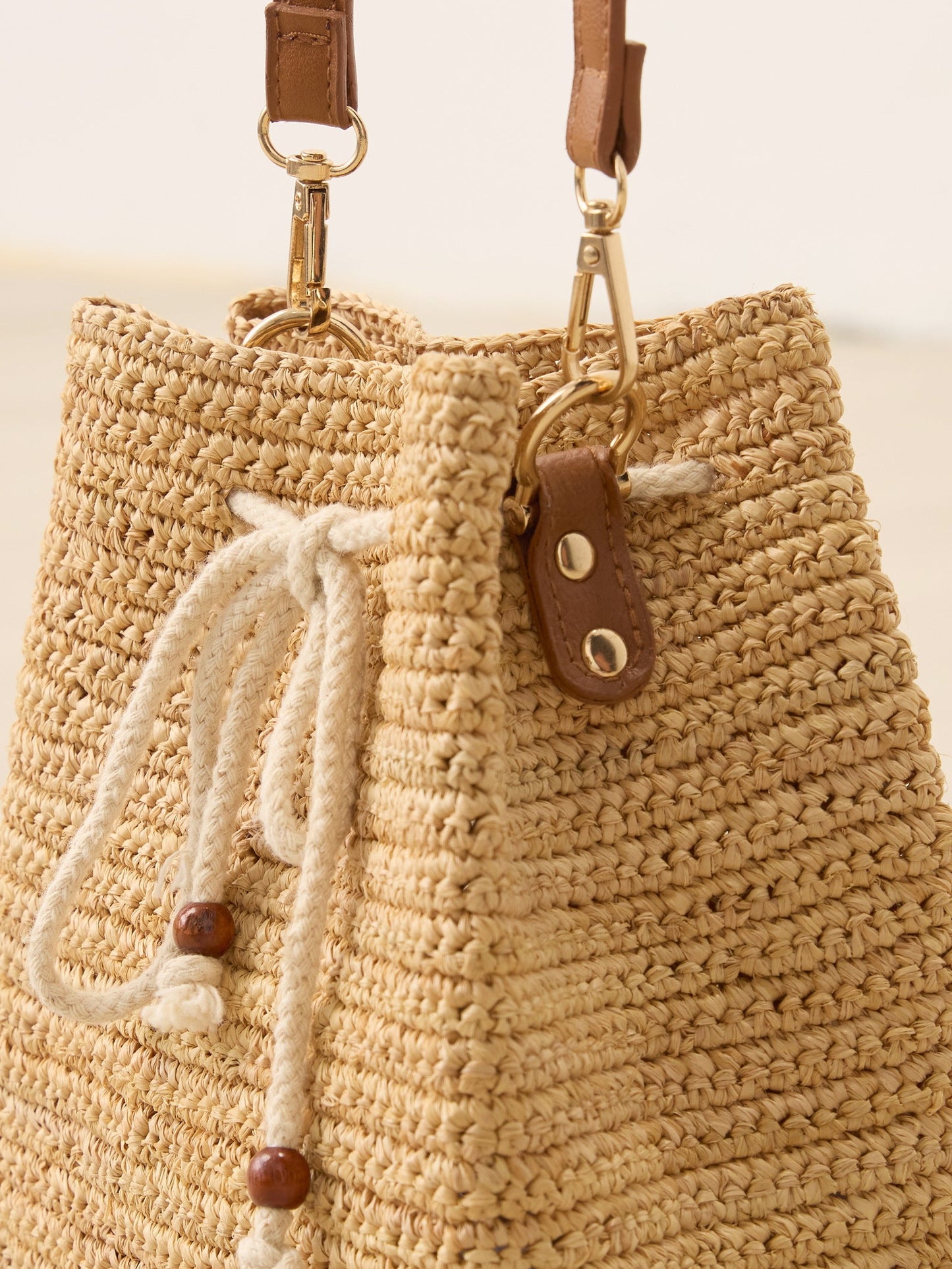 Mini Handwoven Raffia Drawstring Crossbody Bag LINTICO