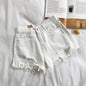 Pocket Tassel Perforated Denim Shorts Female