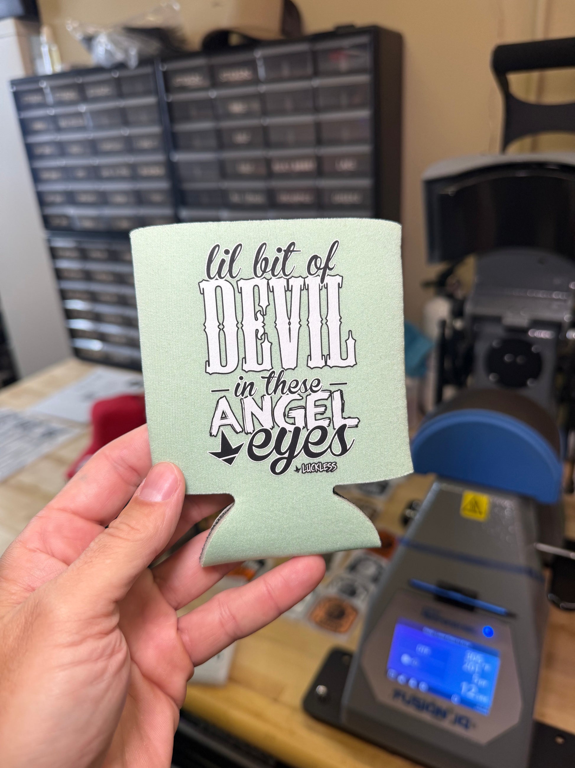 Lil Bit Of Devil in these Angel Eyes Koozie Luckless Outfitters