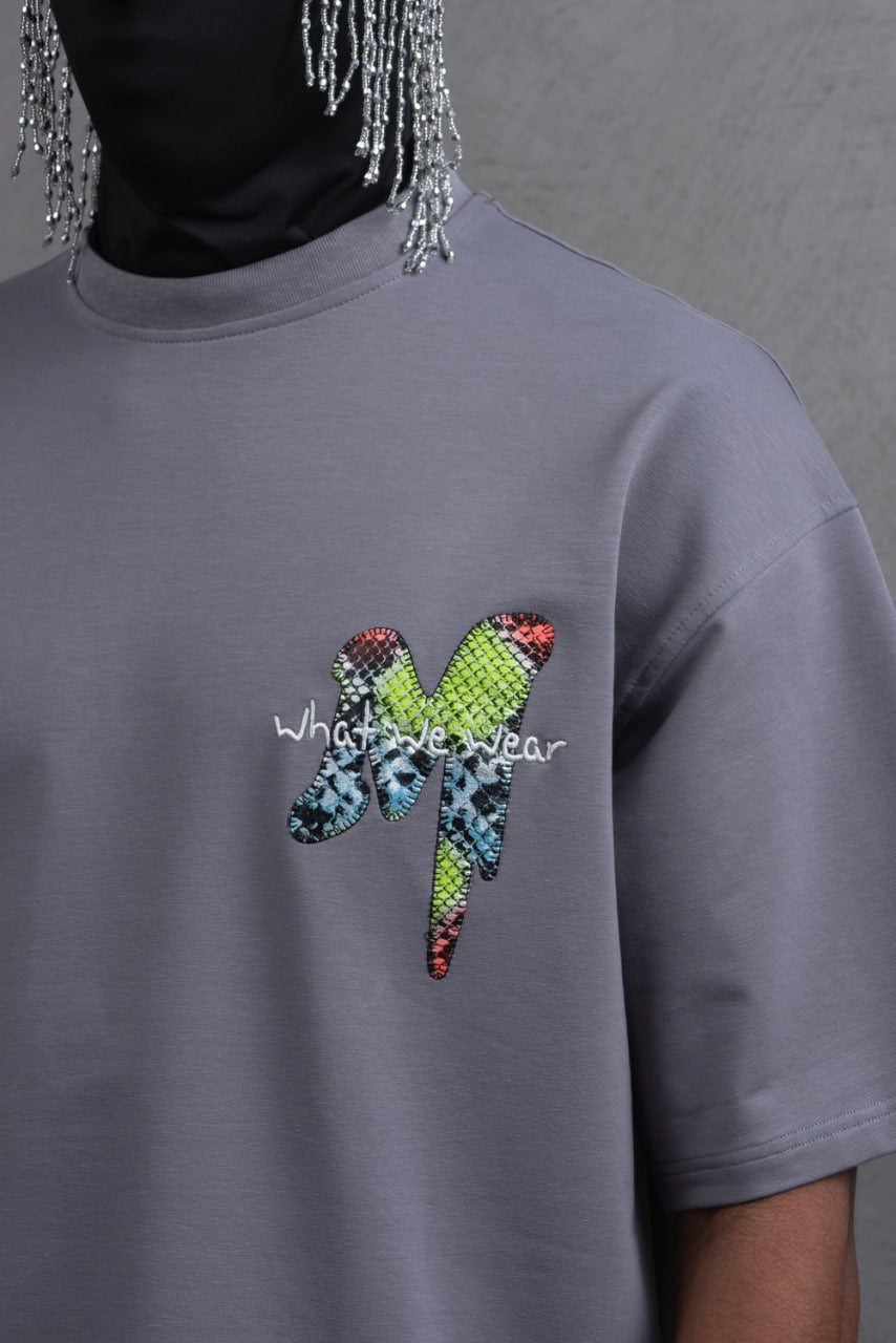 Oversize Graphic Cotton Tee – "What We Wear" Abstract Print Withinblack