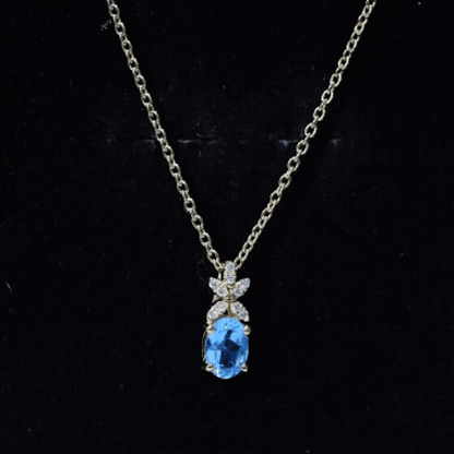 Oval Cut 0.65 Carat Swiss Blue Topaz and Diamond Flower Necklace with Chain