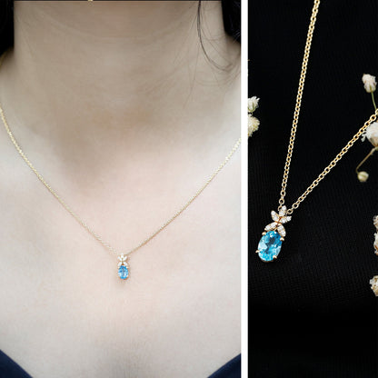 Oval Cut 0.65 Carat Swiss Blue Topaz and Diamond Flower Necklace with Chain