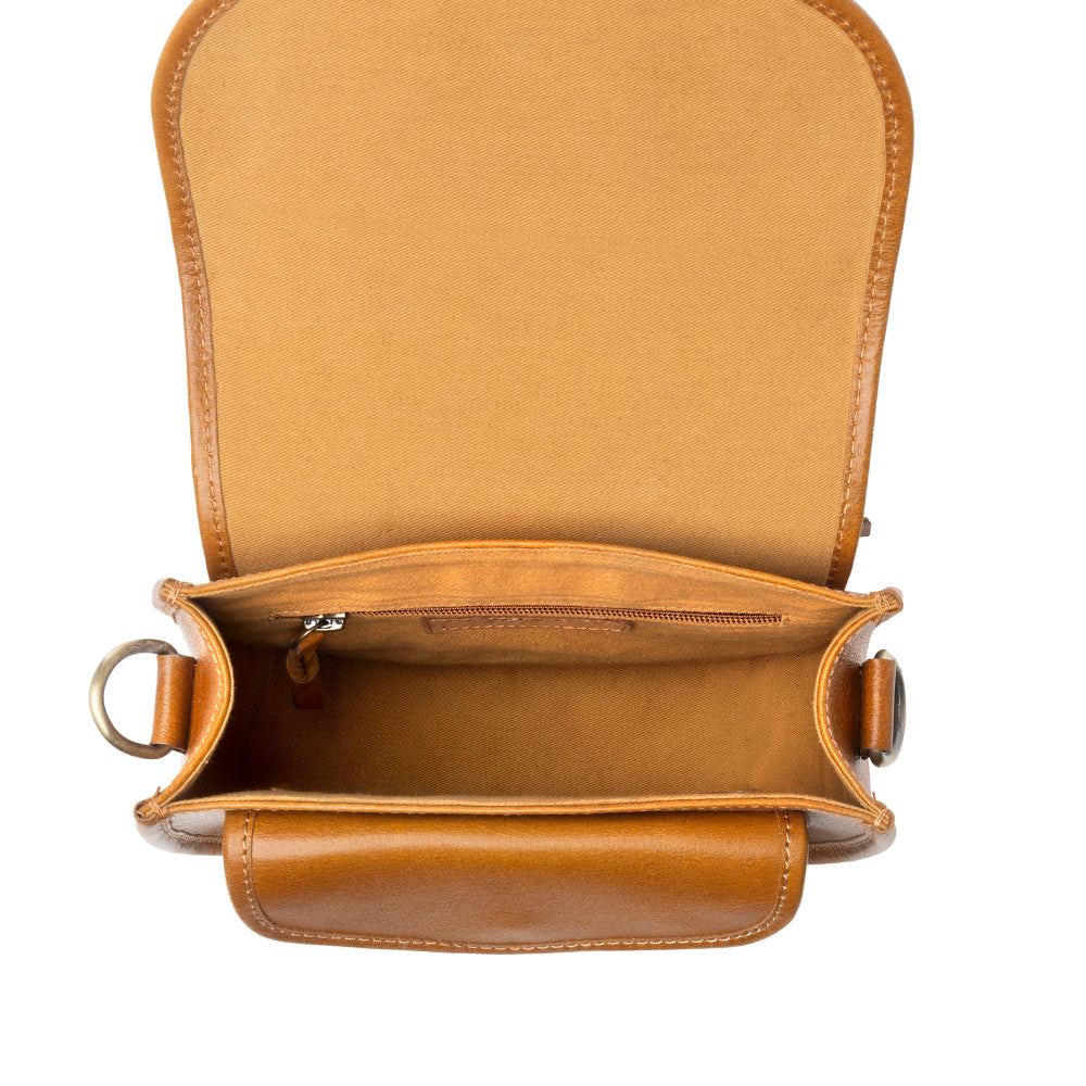 Myra Goldrush Saddle handtooled Bag for Women in saddle tan with hair-on detail Myra USA