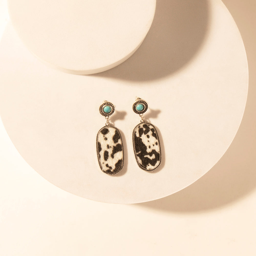 Myra Wild Hide Dangle Earrings for Women with turquoise and cowhide print detail for premium western wear Myra USA