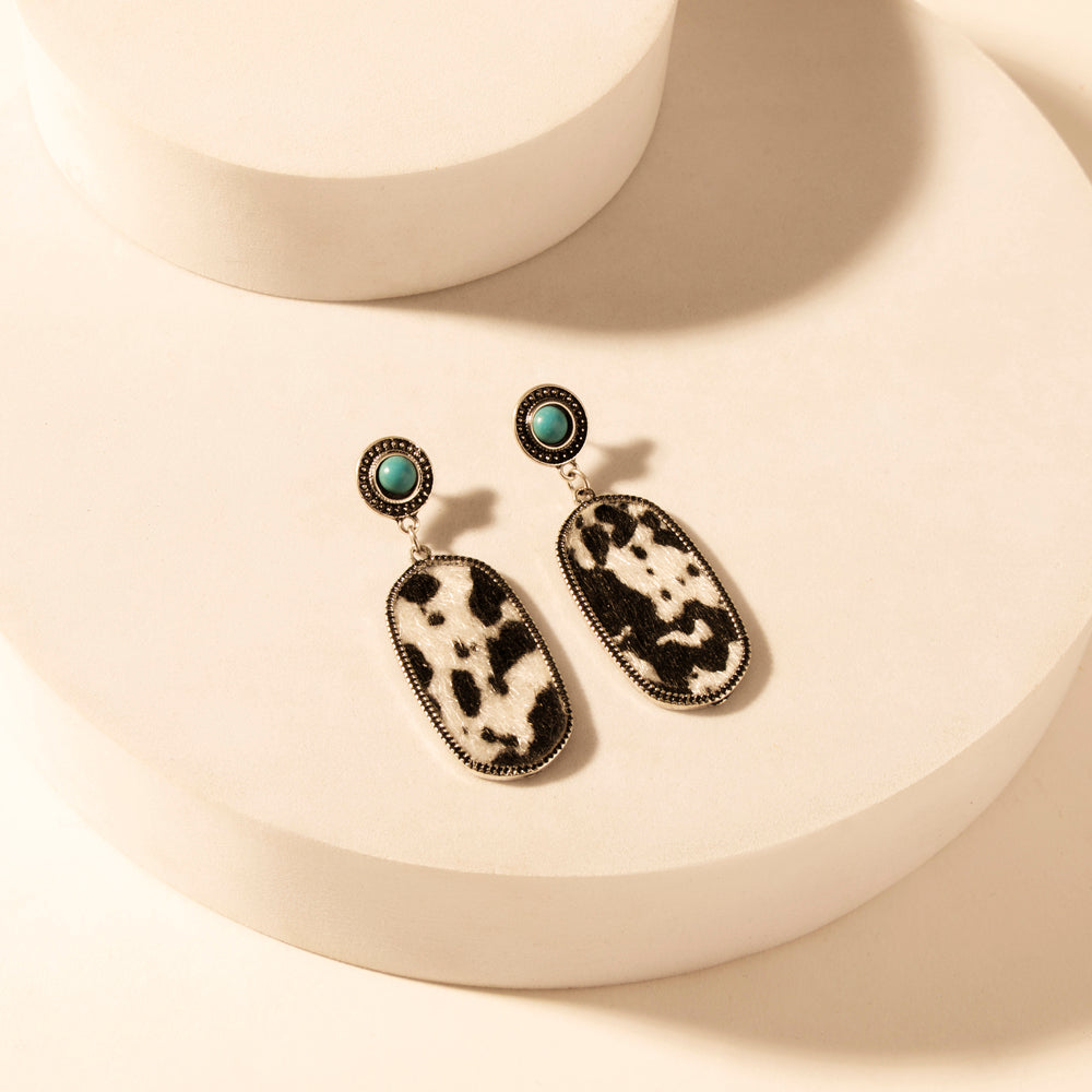 Myra Wild Hide Dangle Earrings for Women with turquoise and cowhide print detail for premium western wear Myra USA