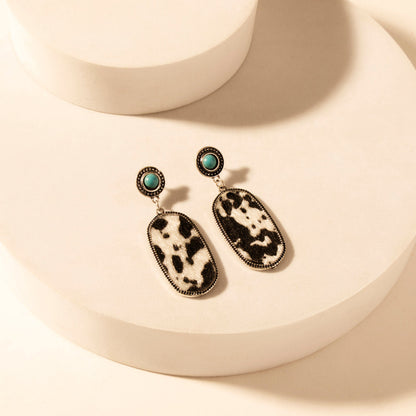 Myra Wild Hide Dangle Earrings for Women with turquoise and cowhide print detail for premium western wear Myra USA