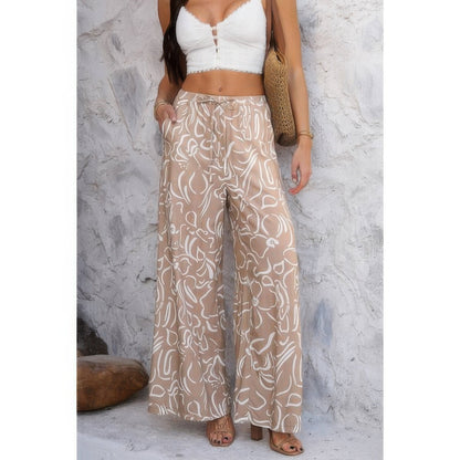 Allover Print Drawstring Pockets Wide Leg Pants See size chart under “more details” The Fashion Celestial