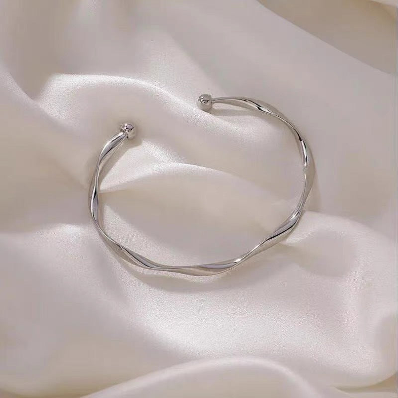 A Sleek And Stylish Twisted Texture Golden Bangle NovaCart