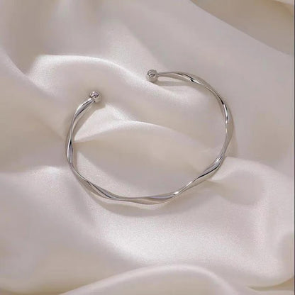 A Sleek And Stylish Twisted Texture Golden Bangle NovaCart