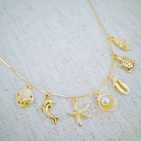 Golden Sea Charm Necklace – Shell, Dolphin & Starf Shop Style & More | Fresh Looks, Everyday Deals & Free Shipping