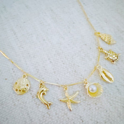Golden Sea Charm Necklace – Shell, Dolphin & Starf Shop Style & More | Fresh Looks, Everyday Deals & Free Shipping