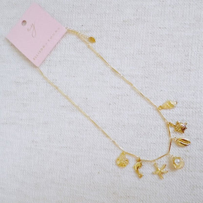 Golden Sea Charm Necklace – Shell, Dolphin & Starf Shop Style & More | Fresh Looks, Everyday Deals & Free Shipping