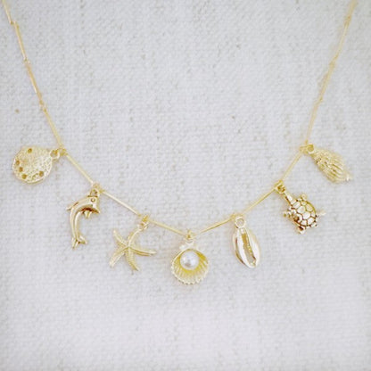Golden Sea Charm Necklace – Shell, Dolphin & Starf Shop Style & More | Fresh Looks, Everyday Deals & Free Shipping