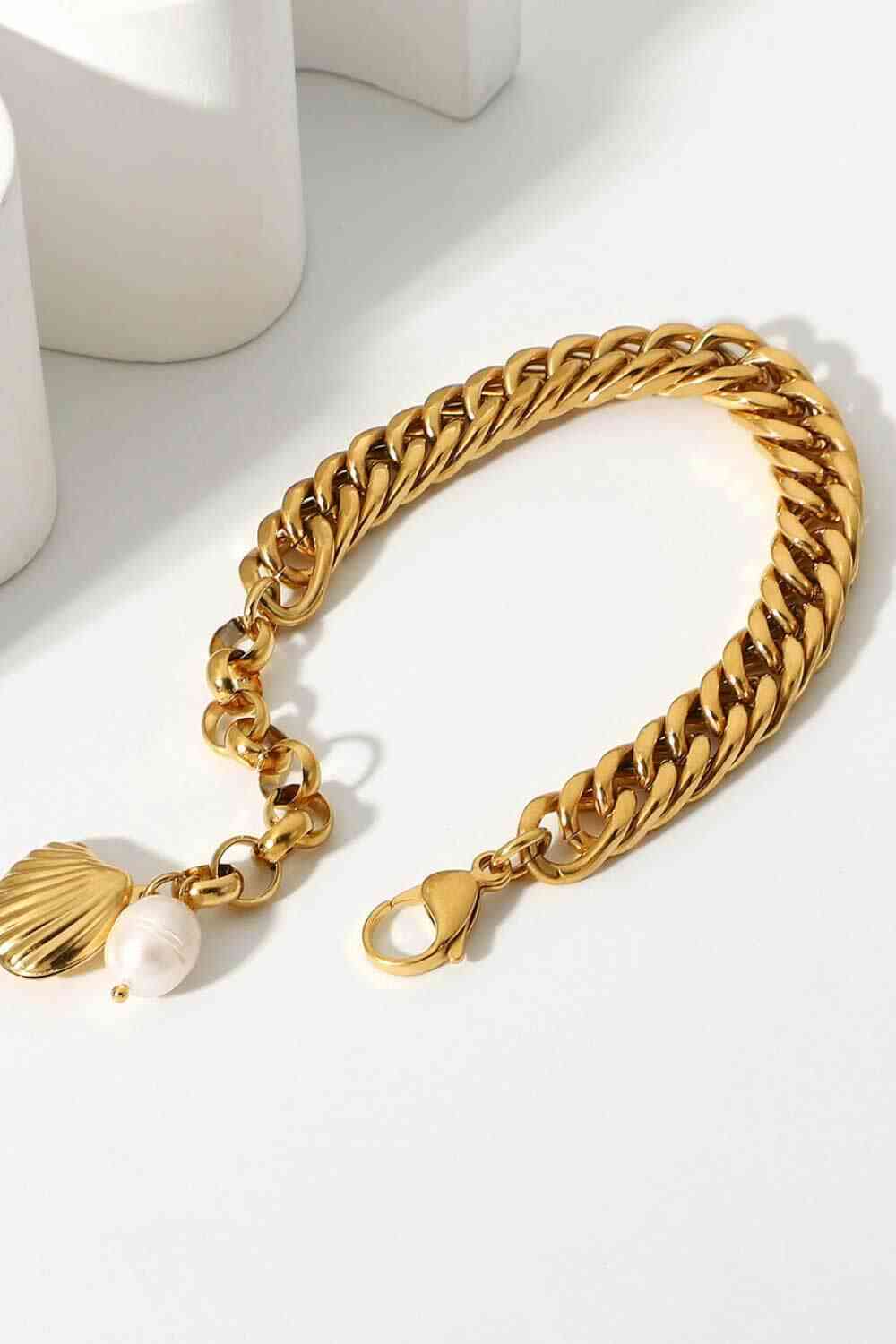 GlamGold 18K Gold-Plated Curb Chain Bracelet – Elegant Pearl Accent See size chart under “more details” The Fashion Celestial