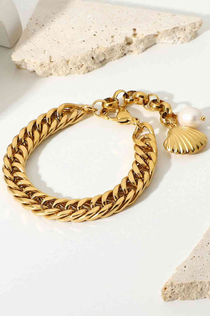 GlamGold 18K Gold-Plated Curb Chain Bracelet – Elegant Pearl Accent See size chart under “more details” The Fashion Celestial