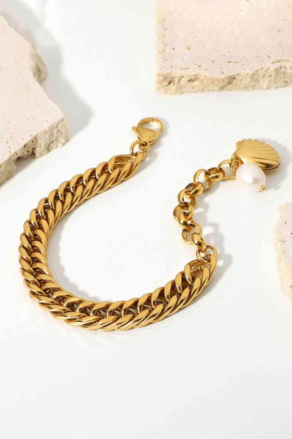 GlamGold 18K Gold-Plated Curb Chain Bracelet – Elegant Pearl Accent See size chart under “more details” The Fashion Celestial