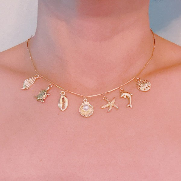 Golden Sea Charm Necklace – Shell, Dolphin & Starf Shop Style & More | Fresh Looks, Everyday Deals & Free Shipping